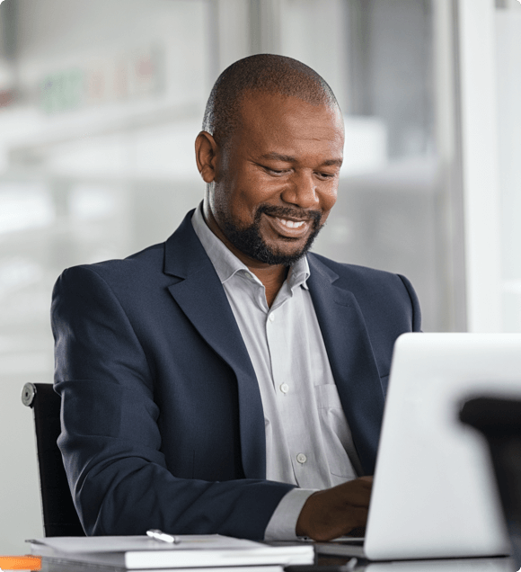 Professional male in front of a computer at a desk - Reporting &amp; Analytics HealthStream