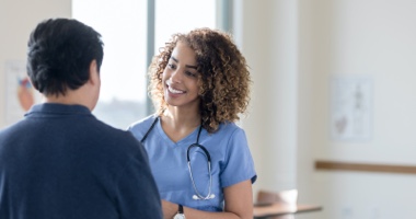 Happy medical professional in conversation - HealthStream Clinical Development
